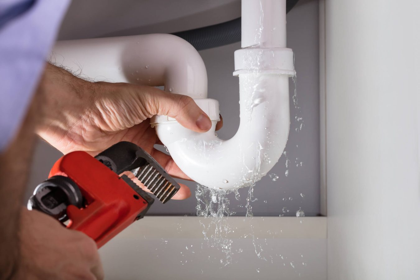 Repairing sink water leak during home bathroom renovation